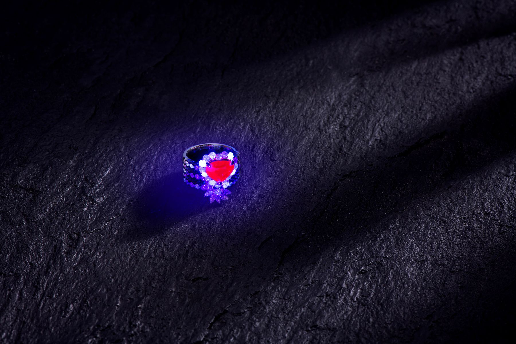Side-by-side comparison of unheated rubies from Burma, Mozambique and Madagascar showing colour and fluorescence differences